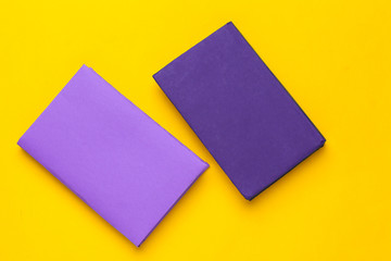 Books on a yellow background