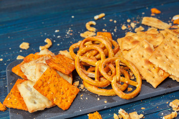 wide selection of snacks for beer on wooden background