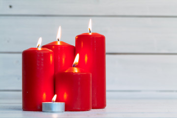 home lighting candles on wooden table