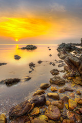 The sea and rocks at sunrise, Phakit Island, Chumphon, Thailand