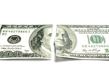 Torn one hundred dollar banknote 