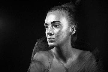 Fototapeta na wymiar Beautiful woman portrait with metallic glow