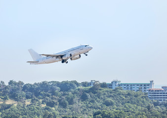 White commercial airplane flying take off from runway at Samui Airport, Samui island, Surat Thani, Thailand travel destinations concept.