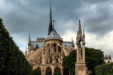 Fototapeta na wymiar Notre-Dame de Paris cathedral under cloudy sky.