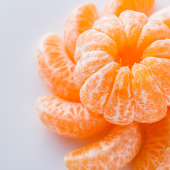 juicy mandarin on a white acrylic background