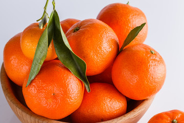 juicy mandarin on a white acrylic background