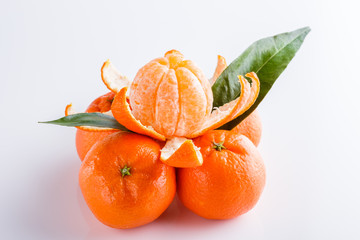 juicy mandarin on a white acrylic background