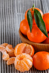 juicy mandarin on a gray wooden rustic background