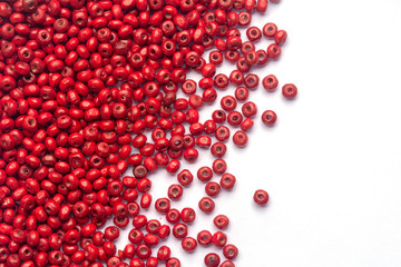 abstract beautiful red colors wooden beads on white background