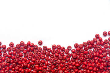 abstract beautiful red colors wooden beads on white background