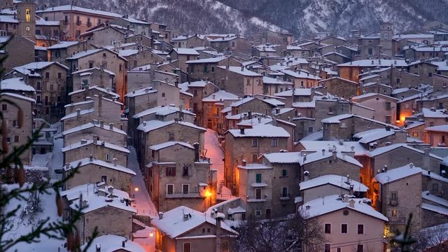The beautiful Scanno covered in snow during a cold winter evening. Abruzzo, central Italy.
