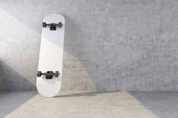 Poster Im Rahmen white skateboard on concrete wall background © petrovk