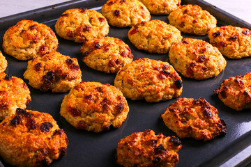 Baked cottage cheese and oatmeal cookies with raisins. Healthy nutrition, diet food.