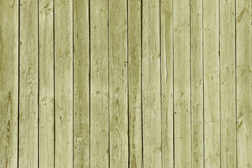 The texture of green from old wooden planks arranged in a vertical order. Background for further design. Ancient building material. Rough relief texture of natural wood. Combustible insulating surface