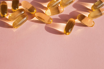 Pills or dietic supplements on the pink backgound