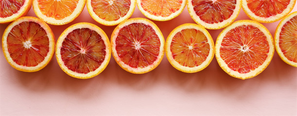 Fototapeta na wymiar Red blood orange fruit Background. Oranges Slices. Healthy Food