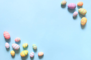 Easter eggs on blue background. The view from the top.