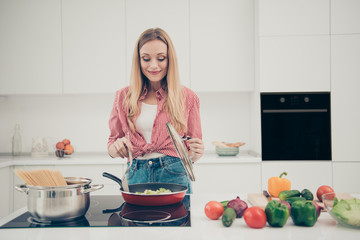 Close up photo beautiful she her lady adore cooking process housewife wait husband back prepare delicious dish meal wear domestic home apparel shirt jeans denim outfit bright home kitchen indoors