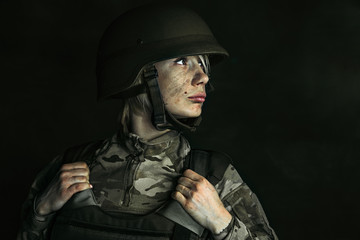 Fototapeta premium Portrait of young female soldier