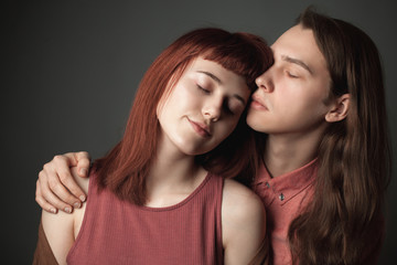 Young woman and the handsome man are hugging