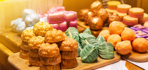 Shop cosmetic handmade bombs and bubble bath different colors. The concept of Spa and relaxation