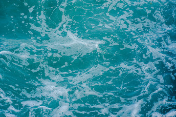 Sea water with waves and foam.