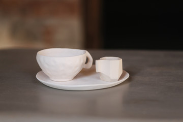 Ceramic cup for tea coffee and plate on the table