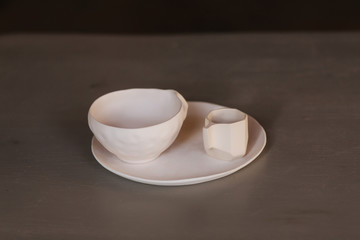 Ceramic cup for tea coffee and plate on the table