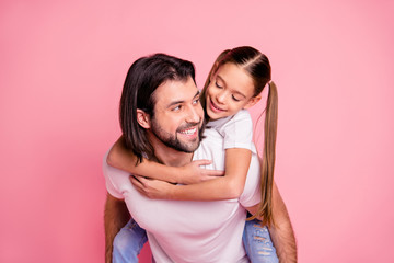 Close up photo beautiful adorable she her little lady he him his daddy dad hold little princess piggyback hands arms funny funky wear casual white t-shirts denim jeans isolated pink bright background