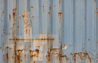 Damaged, metalic texture with some rust on it
