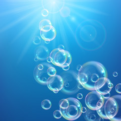 Realistic transparent floating soap bubbles with rainbow reflection. Design element for advertising booklet, flyer or poster