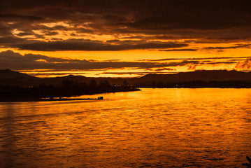 In the morning, the sun rises on the banks of the Mekong River in the Golden Triangle, Chiang Rai, Thailand.