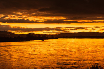 In the morning, the sun rises on the banks of the Mekong River in the Golden Triangle, Chiang Rai, Thailand.