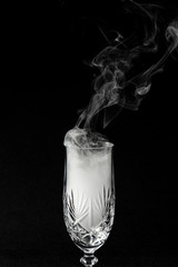 CloseUp glass with fog at dark background