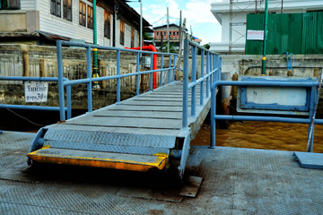 Cross River Ferry Pier at Wat Kalayanamitr Temple. (Translation Text are "Maximum Weight of 250 Persons" and "Under Construction Area.)
