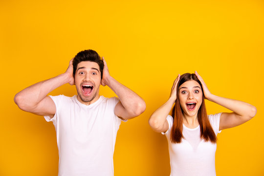 Close up photo two amazing beautiful she her he him his couple standing side by side oh yeah yes expression yelling unbelievable good news wear casual white t-shirts outfit isolated yellow background