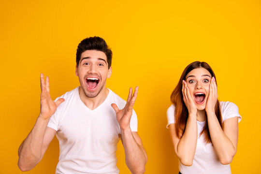 Close up photo amazing she her he him his couple hands arms raised air yell unbelievable luck lucky day cheerleader football match wear casual white t-shirts outfit isolated yellow background