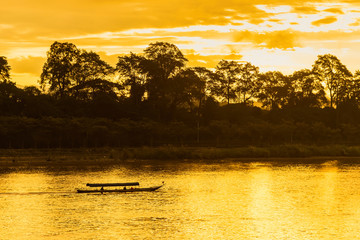 The ship is sailing in the Mekong River in In the morning, the sunrise in the Golden Triangle, Chiang Rai, Thailand