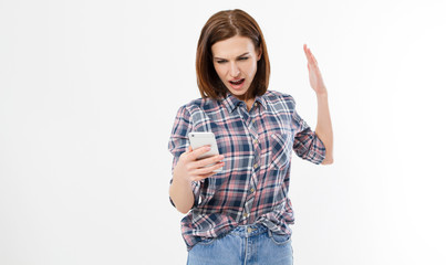 Shocked frustrated young woman with phone. Female with anger on cell phone. Portrait of an angry brunette woman screaming on mobile phone. Human emotion, reaction, expression .