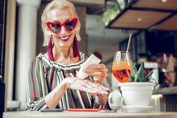 Cheerful happy woman posing for her selfie