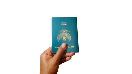 Close up hand holding indonesian passport isolated on white background - Image