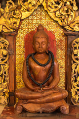 Fototapeta premium Carved wooden Buddha at Baandam.Thailand.