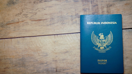 Top view of indonesian passport on wooden desktop - Image