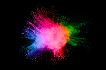 Colorful background of pastel powder.Multi colored dust splash on black background.Painted Holi.