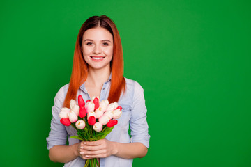 Close up photo beautiful she her lady hands arms hold flowers lovely nature freshness attitude morning 8 march overjoyed expression wear casual jeans denim shirt isolated green bright background