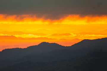 Sunrise.Mountain valley during sunrise. Natural summer landscape.Lighting before sunrise at the morning time.Thailand.