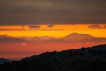 Sunrise.Mountain valley during sunrise. Natural summer landscape.Lighting before sunrise at the morning time.Thailand.