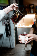 young woman with cup of tea