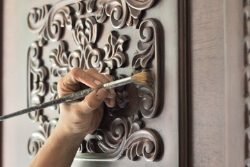 Carpenter cutting door by hand