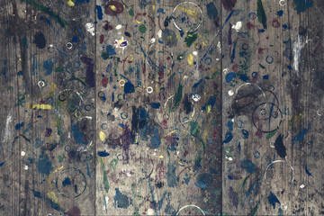 Top view. Old paint stained artist empty table. Artistic background